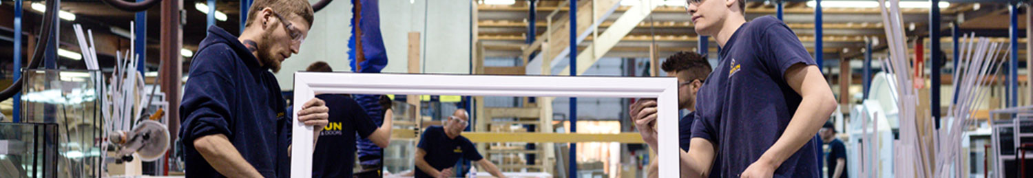 Two Verdun employees assembling a PVC window in Ottawa, ON.