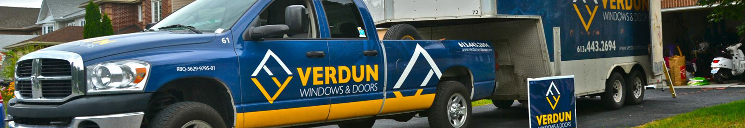 A Verdun truck parked in the driveway of a replacement window client.