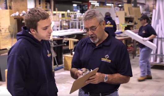 Two Verdun employees talking about the window manufacturing plant in Ottawa