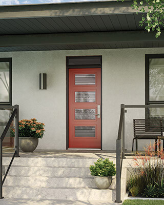 A bold red front door with four glass inserts