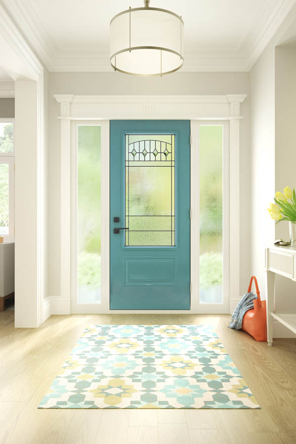 A modern, teal entry door with Liano glass inserts on an Orleans door slab.