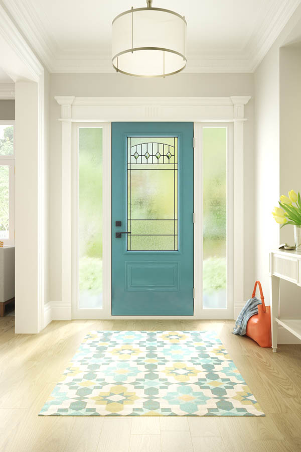 Une porte d'entrée turquoise moderne avec des inserts en verre Liano sur une dalle de porte Orleans.