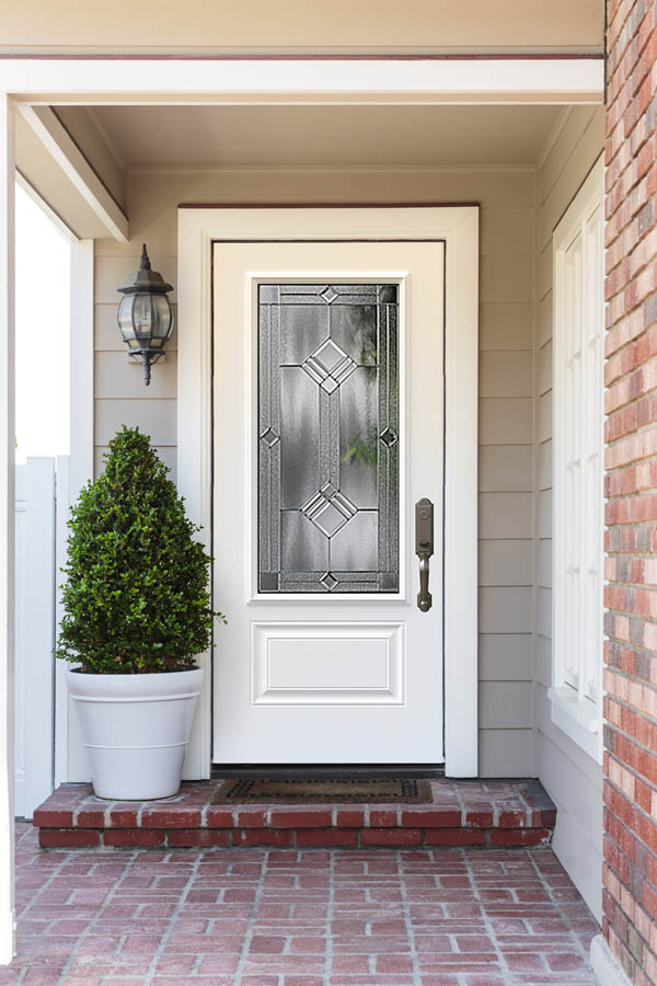 A white entry door with Pixel glass inserts on an Orleans door slab.