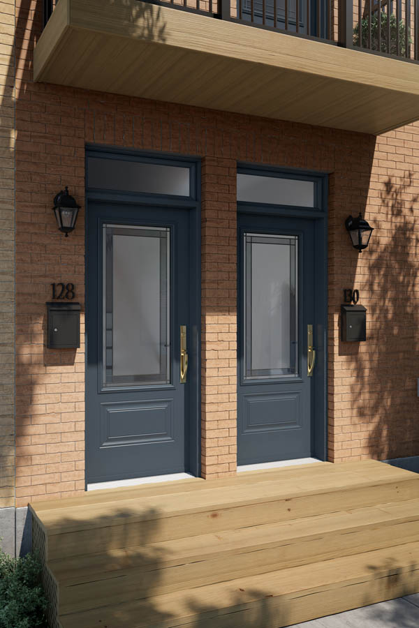 A pair of entry doors with Winchester glass inserts on an Orleans door slab.