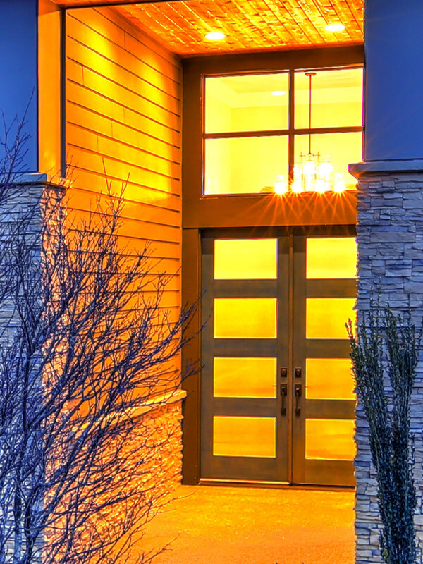 White double entry doors with rectangular transom and double sidelites